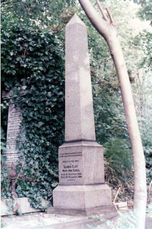 Obelisco de pedra em um jardim com uma inscrição em comemoração a Eliot